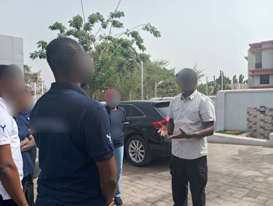 Field briefing: Outdoor practical briefing before an exercise. Faces and written details are blurred for privacy.